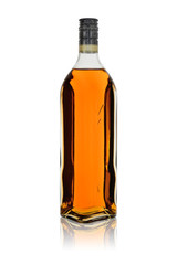 Glass bottle of alcoholic drink rum or brandy with reflection. Isolated on a white background