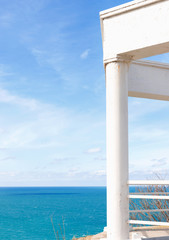 Observation deck with white colonnade on the coast