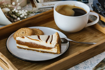 Dessert for a cup of coffee: a piece of chocolate, caramel cake