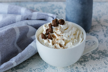 Cappuccino coffee, raf, flat white with whipped cream, sprinkled with chocolate