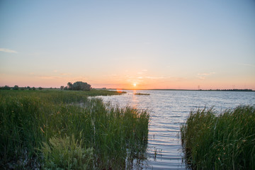 Sunset on the lake on a summer evening