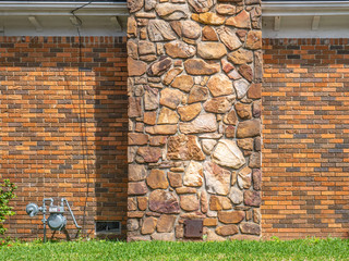 brick wall with stone chimney