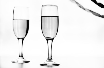 monochrome photo of champagne on white table on white background isolate