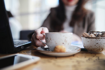 Girl eating coffee cakes