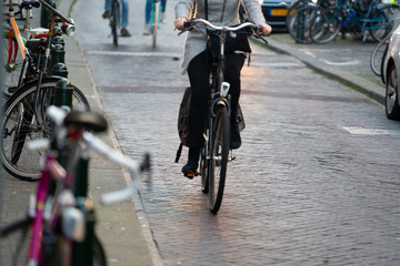 People ride a bicycle in the city