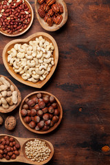 Various nuts selection on wooden table