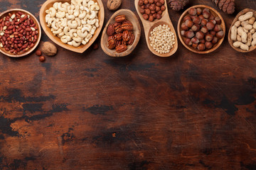 Various nuts selection on wooden table