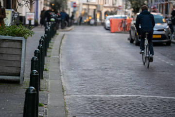 A man ride a bicycle in the city