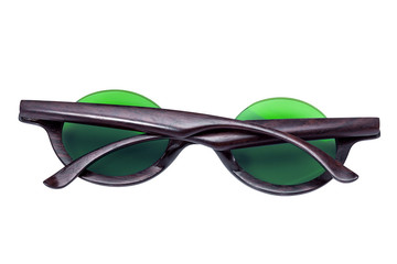 Sunglasses with wooden rim and round green glass rear view, isolated object on white background.