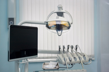 Dentist office. Dental treatment unit and equipment with blur background.