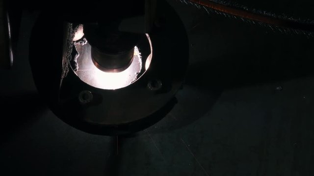 Close-up Top View Of The Laser Head Cuts A Metal Sheet