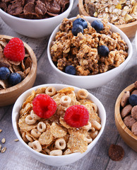 Bowls with different sorts of breakfast cereal products