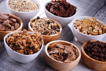Bowls with different sorts of breakfast cereal products