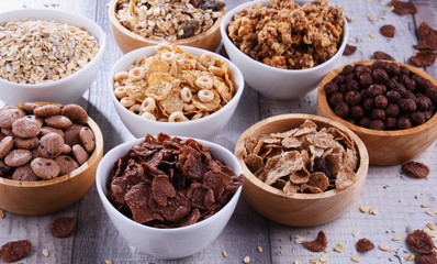 Bowls with different sorts of breakfast cereal products