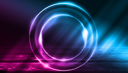 Empty background scene. Dark street, a reflection of blue and pink neon light on wet pavement. Rays of light in the dark, smoke. Night view of the street, the city. Abstract dark background.