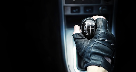 Gear lever. Manual Transmission. Hand on the gear shift in the car.