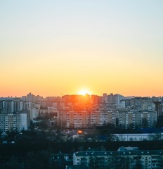 sunset in the city, sleeping area, high-rise buildings of the 2000s