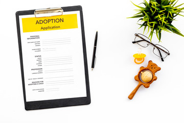 Family and adoption child concept with application, dummy, toy, glasses on white background top view