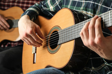 Fototapeta premium Two guitar players with classic guitars, space for text