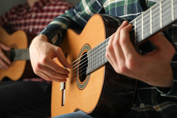 Fototapeta premium Two guitar players with classic guitars, space for text