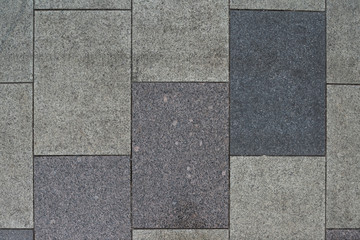 Gray granite. Rectangular pavement slab. Top view.
