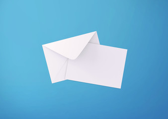 White postcard and envelope on background, top view. Blank envelope mockup and letterhead presentation template. Postcard flyer for your design.