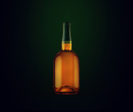 Full whiskey bottle on dark background. Product packaging brand design. Mock up drink with place for you lable and text. Old and tasty scotch whisky against lit background.