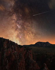 Beautiful red rocks and the close up milky way galaxy.