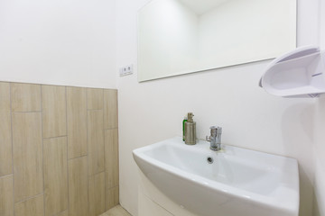 closeup faucet and lavatory white marble restroom interior concept