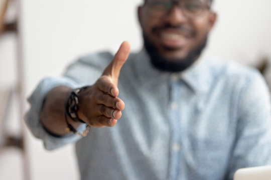 African professional businessman recruiter consultant extending hand at camera