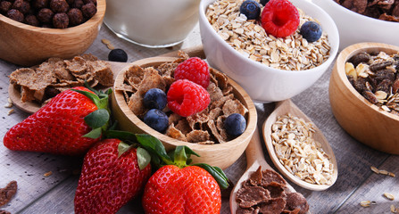 Bowls with different sorts of breakfast cereal products