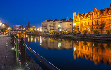 Fototapeta na wymiar Bydgoszcz old town at amazing sunrise with reflection in Brda river. Bydgoszcz. Poland