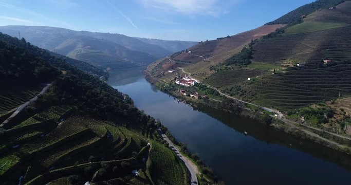 Aerial view of the terraced vineyards in the Douro Valley and river near the village of Pinhao, Portugal; 