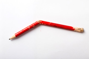 Broken red pencil on white - Powered by Adobe