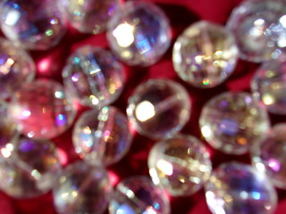 blurred sparkling background. crystal ball. round glass beads. play of light