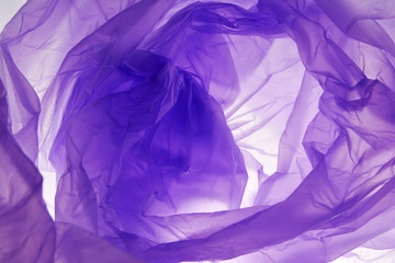 Plastic bag background. Abstract purple stain texture. Splash template for design. Violet texture.