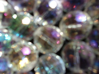 blurred sparkling background. crystal ball. round glass beads. play of light