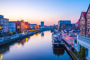 Bydgoszcz old town at amazing sunrise with reflection in Brda river. Bydgoszcz. Poland - obrazy, fototapety, plakaty