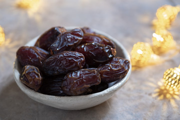 Fresh Medjool Dates in a bowl. Ramadan kareem.