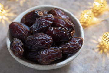 Fresh Medjool Dates in a bowl. Ramadan kareem.