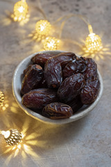 Fresh Medjool Dates in a bowl. Ramadan kareem.