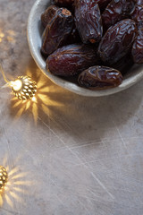 Fresh Medjool Dates in a bowl. Ramadan kareem.