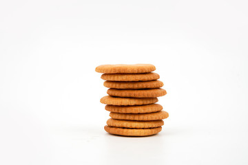 Stack of salted biscuits isolated on white background.