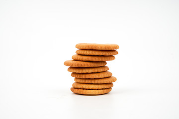 Stack of salted biscuits isolated on white background.