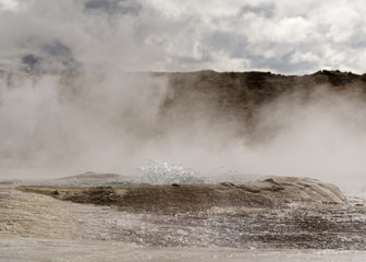 Geothermal area with strong steam outlet, center of a basin where hot water bubbles, mineral deposits - Location: Iceland