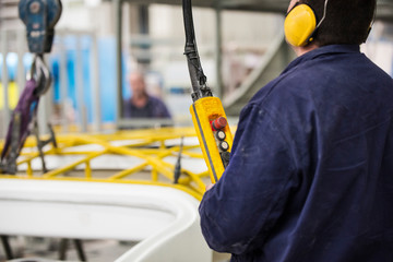 worker handling the crane