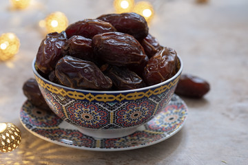 Fresh Medjool Dates in a bowl. Ramadan kareem.