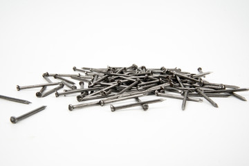 Bunch of metal nails on white background
