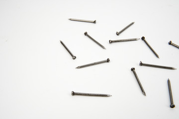 Bunch of metal nails on white background