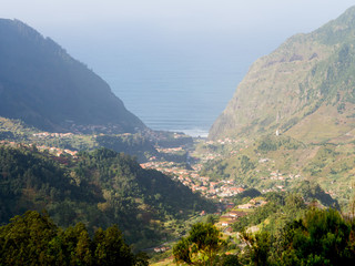View of a valley in Madeira island, Portugal, with the Atlantic Ocean in the background